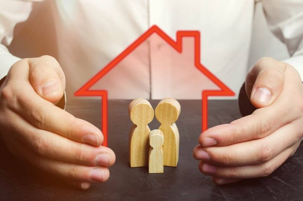 bigstock-Insurance-Agent-Holds-Hands-Ov-275571802.jpg